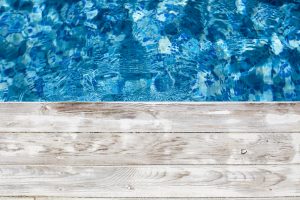 Swimming-pool-and-wooden-deck-ideal-for-backgrounds-801239442_5518x3679